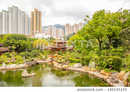 Ancient Wooden Pavilion on a Pond and Hong Kongs Skyscrapers Ancient Wooden Pavilion on a Pond and Hong Kongs Skyscrapers 140145245