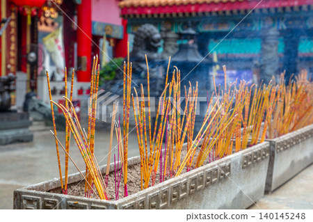 Incense Sticks in Front of a Buddhist Temple Incense Sticks in Front of a Buddhist Temple 140145248