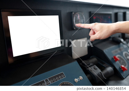 Captain hand pointing at blank monitor screen on boat dashboard Captain hand pointing at blank monitor screen on boat dashboard 140146854