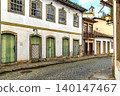 Aged colonial-style houses 140147467