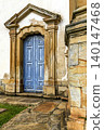 Church door with carved stone 140147468