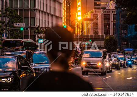 Tokyo cityscape at sunset...thoughts on the Japanese economy...Yaesu and Otemachi, redevelopment...cars, National Route 1...young women...traffic lights Tokyo cityscape at sunset...thoughts on the Japanese economy...Yaesu and Otemachi, redevelopment...cars, National Route 1...young women...traffic lights 140147634