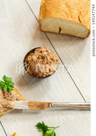 Top view of rustic pate sandwiches on white table Top view of rustic pate sandwiches on white table 140147744