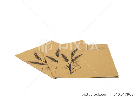 fan of three closed craft school notebooks with ears on a white background fan of three closed craft school notebooks with ears on a white background 140147963