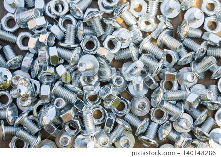 Metal bolts and nuts background for construction and hardware concept Metal bolts and nuts background for construction and hardware concept 140148286