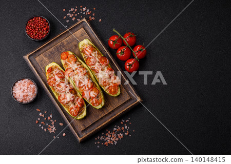 Baked zucchini half with minced meat, tomatoes, cheese, salt, and spices. Zucchini with minced meat Baked zucchini half with minced meat, tomatoes, cheese, salt, and spices. Zucchini with minced meat 140148415