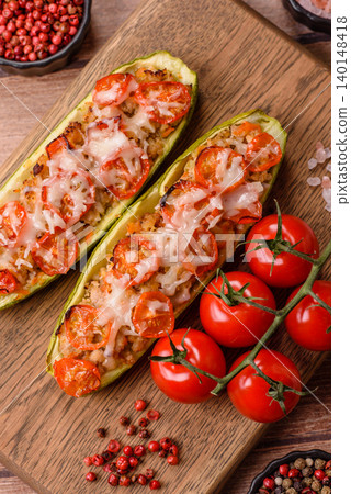 Baked zucchini half with minced meat, tomatoes, cheese, salt, and spices. Zucchini with minced meat Baked zucchini half with minced meat, tomatoes, cheese, salt, and spices. Zucchini with minced meat 140148418