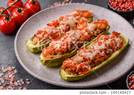 Baked zucchini half with minced meat, tomatoes, cheese, salt, and spices. Zucchini with minced meat Baked zucchini half with minced meat, tomatoes, cheese, salt, and spices. Zucchini with minced meat 140148427