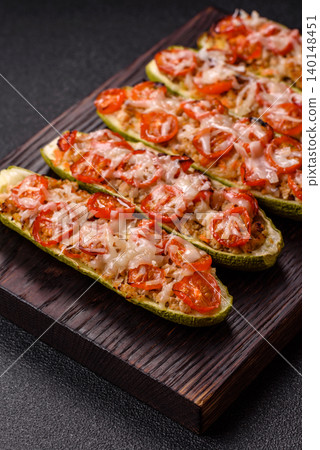 Baked zucchini half with minced meat, tomatoes, cheese, salt, and spices. Zucchini with minced meat Baked zucchini half with minced meat, tomatoes, cheese, salt, and spices. Zucchini with minced meat 140148451