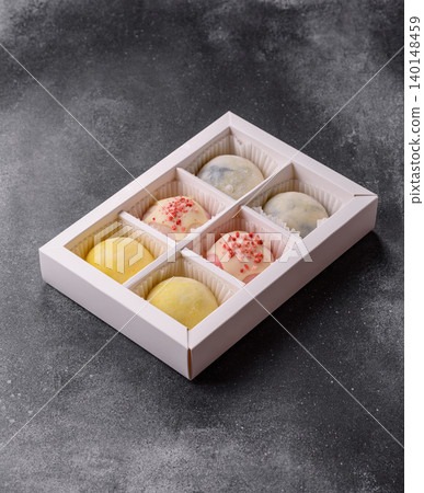 Japanese sweet frozen mochi with rice dough, fruit, and chocolate filling. Japanese mochi 140148459