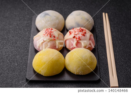 Japanese sweet frozen mochi with rice dough, fruit, and chocolate filling. Japanese mochi 140148466