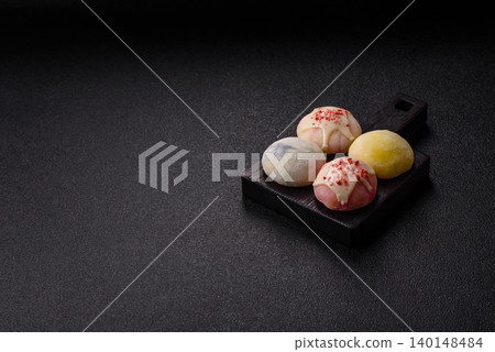 Japanese sweet frozen mochi with rice dough, fruit, and chocolate filling. Japanese mochi 140148484