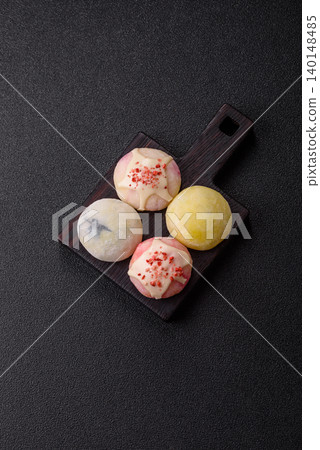 Japanese sweet frozen mochi with rice dough, fruit, and chocolate filling. Japanese mochi 140148485