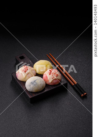 Japanese sweet frozen mochi with rice dough, fruit, and chocolate filling. Japanese mochi 140148493