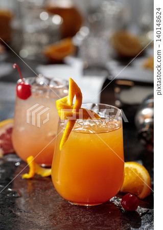 Summer refreshing cocktails with ice, orange and grapefruit juice. 140148624