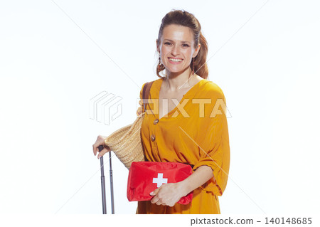 Woman Ready for Holiday with Suitcase and Travel First Aid Kit Woman Ready for Holiday with Suitcase and Travel First Aid Kit 140148685