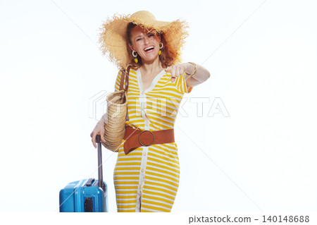 Smiling Woman with Suitcase Pointing at Camera Smiling Woman with Suitcase Pointing at Camera 140148688