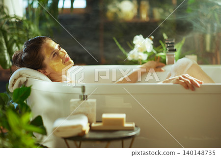 Tranquil Self-Care: Woman with Face Mask Tranquil Self-Care: Woman with Face Mask 140148735