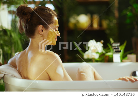 Tranquil Back View: Woman in Spa Bathtub 140148736