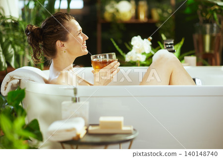 Serene Bath Time with a Refreshing Drink Serene Bath Time with a Refreshing Drink 140148740