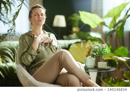 Woman Practicing Breathwork and Mindful Grounding at Home Woman Practicing Breathwork and Mindful Grounding at Home 140148834