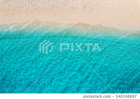 Relaxing aerial beach scene, summer vacation holiday template banner. Waves surf with amazing blue ocean lagoon, sea shore, coastline. Perfect aerial drone top view. Peaceful bright beach, seaside 140148897