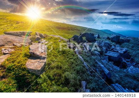 alpine grassy meadow. day meet night. sun and moon over carpathian mountains landscape with boulders. alpine nature scenery of ukraine highlands on summer solstice. view of remote place in mountains alpine grassy meadow. day meet night. sun and moon over carpathian mountains landscape with boulders. alpine nature scenery of ukraine highlands on summer solstice. view of remote place in mountains 140148918