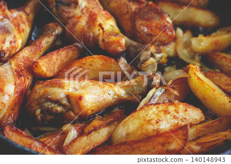 fried chicken drumsticks with potato slices, in a clay pan, baked in the oven, with spices, homemade, no people, fried chicken drumsticks with potato slices, in a clay pan, baked in the oven, with spices, homemade, no people, 140148943
