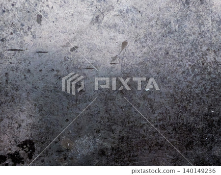 Grunge background material with scratches and stains etched into a metal surface / Inorganic and heavy texture Grunge background material with scratches and stains etched into a metal surface / Inorganic and heavy texture 140149236