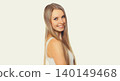 Portrait of beautiful blonde smiling young woman with long hair on white background 140149468