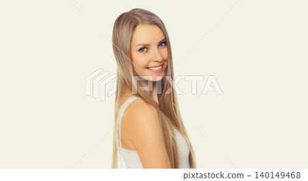 Portrait of beautiful blonde smiling young woman with long hair on white background Portrait of beautiful blonde smiling young woman with long hair on white background 140149468