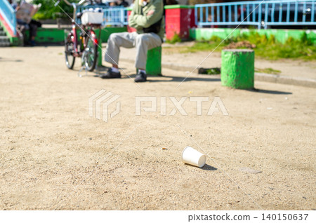 Paper cups littered in the park Paper cups littered in the park 140150637
