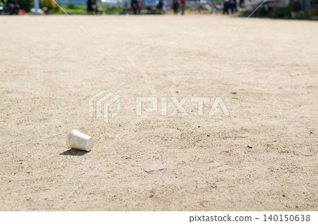Paper cups littered in the park Paper cups littered in the park 140150638