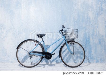 Woman riding a bicycle Woman riding a bicycle 140150875