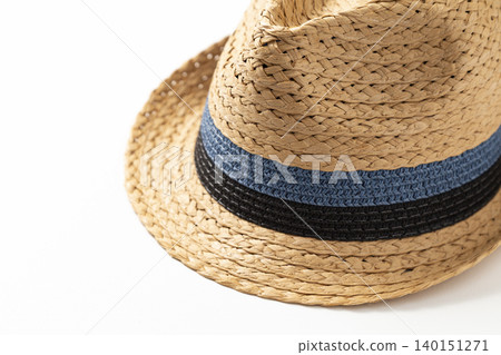 A straw hat against a white background. A straw hat against a white background. 140151271