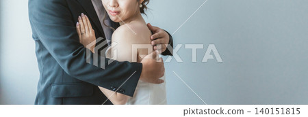 Bride and groom having wedding photos taken (marriage, ceremony, bridal, embracing) 140151815