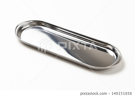 Oval stainless steel tray on a white background Oval stainless steel tray on a white background 140151938