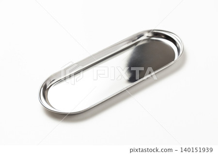 Oval stainless steel tray on a white background Oval stainless steel tray on a white background 140151939