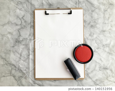 Formal contracts and important procedures; documents on a clipboard with an ink pad, stamp case, and seal placed against a marble-patterned background. Formal contracts and important procedures; documents on a clipboard with an ink pad, stamp case, and seal placed against a marble-patterned background. 140151956