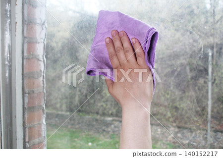 streaks on a dirty window. washing windows by hand streaks on a dirty window. washing windows by hand 140152217