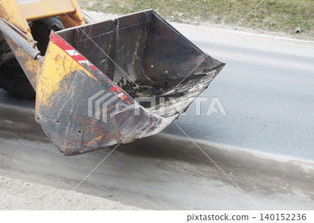 Tractor bucket of a bulldozer close-up. Cleaning Tractor bucket of a bulldozer close-up. Cleaning 140152236