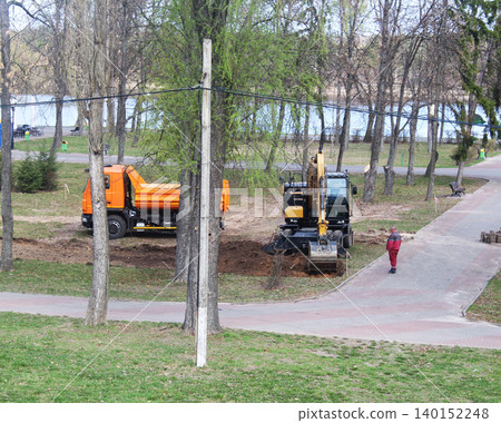 excavator digging trench hole for construction 140152248