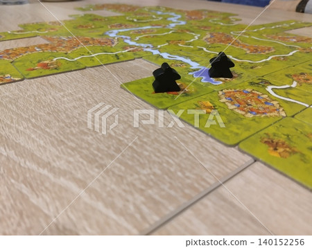 Mozyr, Belarus, April 10 2025: board game Carcassonne. Black Player Chips 140152256