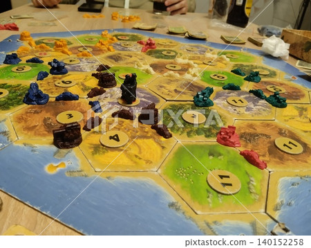 Mozyr, Belarus, April 10 2025: catan board game. Players' chips on the playing field 140152258