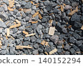 The background is gravel gray on a sunny day. Construction background 140152294