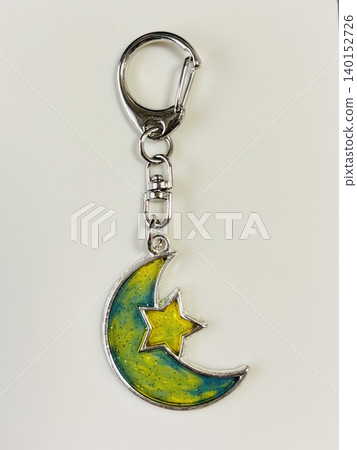 A keychain featuring the moon and stars. A keychain featuring the moon and stars. 140152726