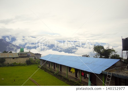Mountain scenery of Australian Camp shrouded in fog (Nepal) Mountain scenery of Australian Camp shrouded in fog (Nepal) 140152977