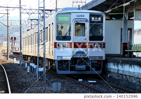 A commuter train, the 10000 series, stops at Akagi Station, the terminal station of the Isesaki Line. A commuter train, the 10000 series, stops at Akagi Station, the terminal station of the Isesaki Line. 140152996