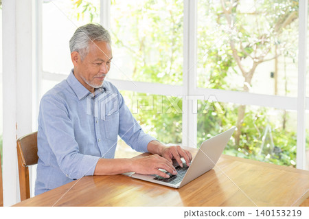 Senior male personal computer Senior male personal computer 140153219