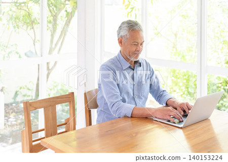 Senior male personal computer Senior male personal computer 140153224